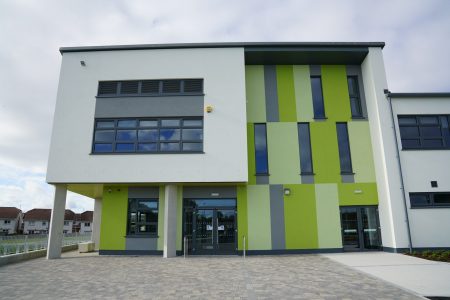 Close up view of the colorful facade system installed for a school